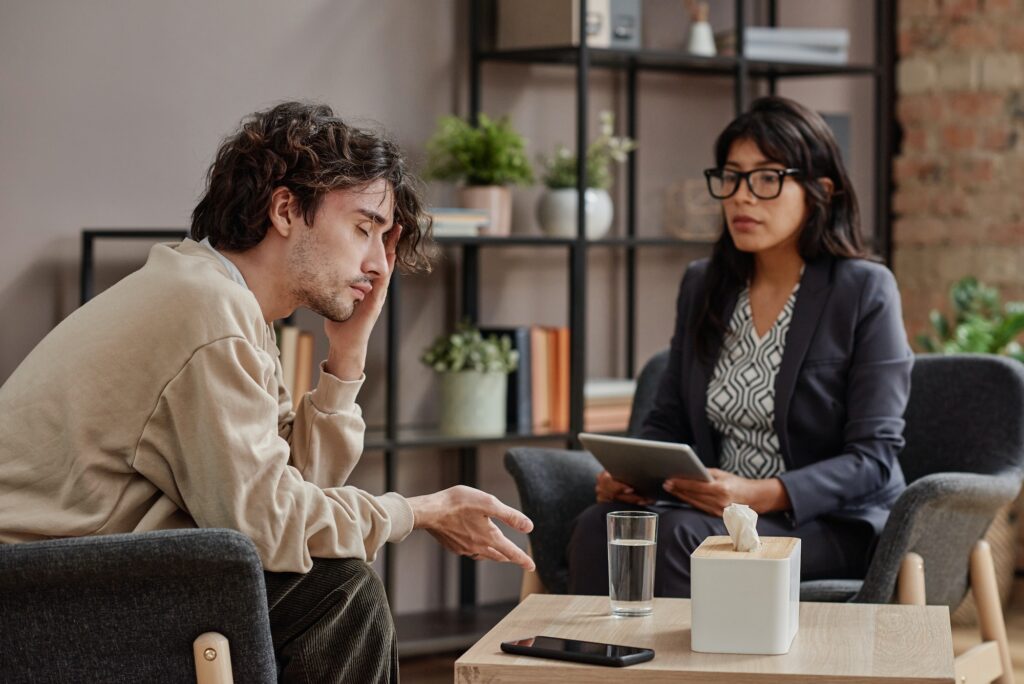 Man Having Counseling at Psychologist